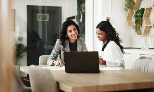 Meeting, women and business people with laptop in office, investment project and discussion. Teamwork, accountant and financial advisor with feedback for finance update, report review and documents